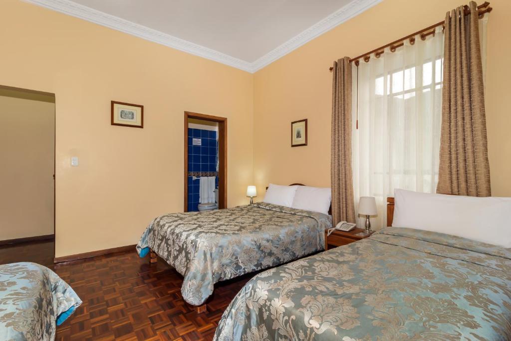 Postel nebo postele na pokoji v ubytování Hotel La Cartuja
