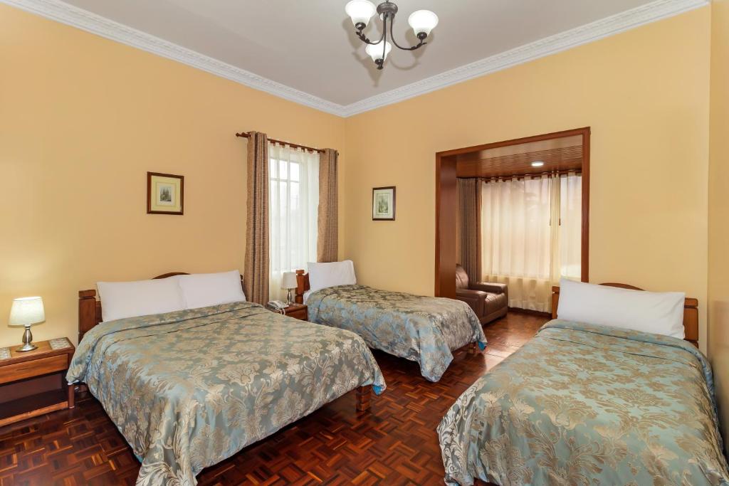 Postel nebo postele na pokoji v ubytování Hotel La Cartuja