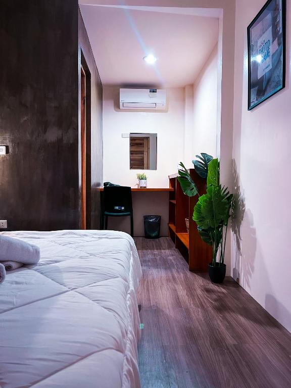 Postel nebo postele na pokoji v ubytování M-Resort Siargao