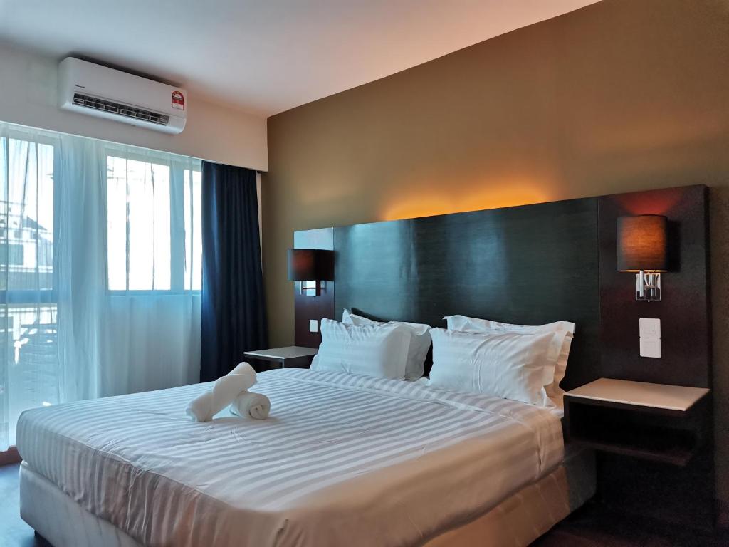 Letto o letti in una camera di Ming Greenage Suite 明绿时代套房 @Kota Kinabalu 亚庇市中心