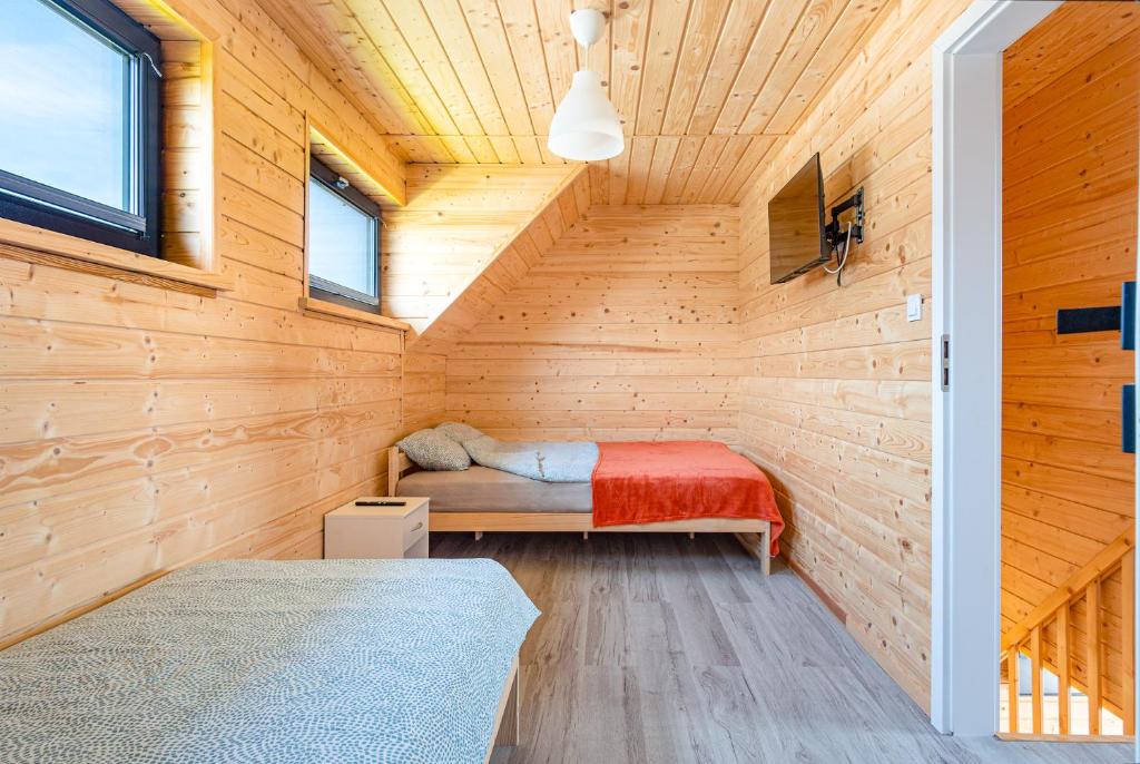 Postel nebo postele na pokoji v ubytování OSADA JANTAR 2