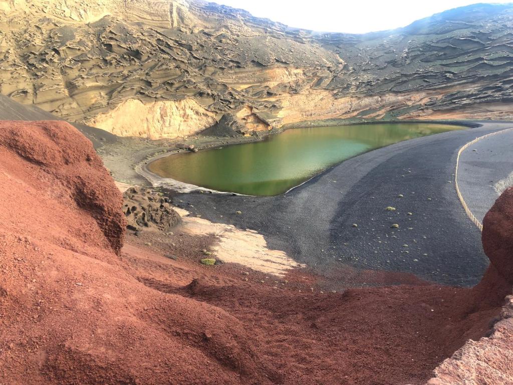 a body of water in the middle of a mountain at Volcano View in El Golfo