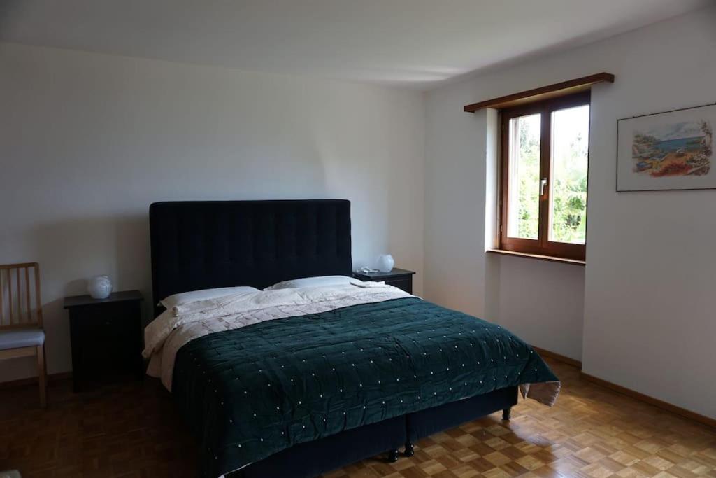 Postel nebo postele na pokoji v ubytování Casa Verbanella