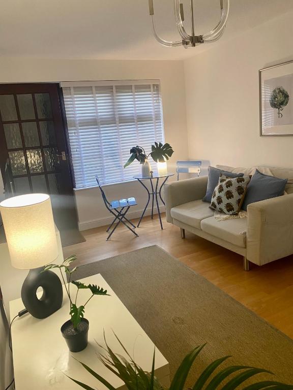 a living room with a couch and a table at Lakeside View 2, Perton Village in Wolverhampton