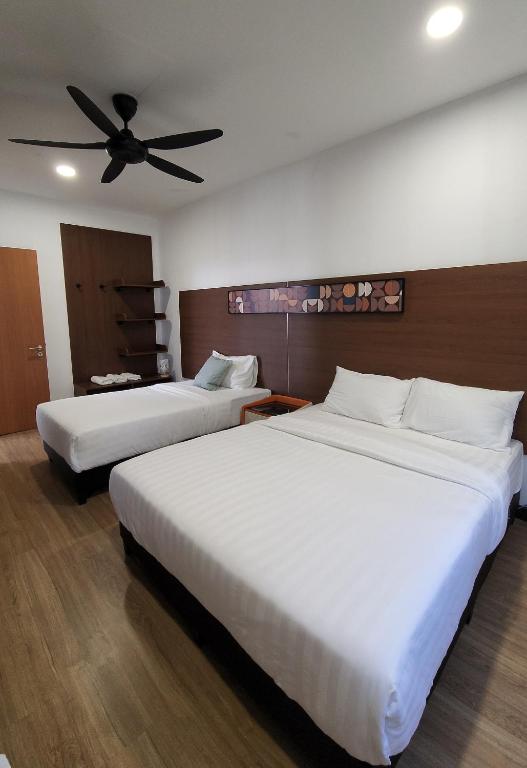Postel nebo postele na pokoji v ubytování Zinnia Residence Tanah Rata