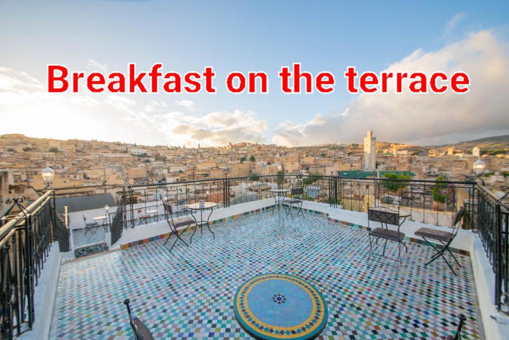 a balcony with a view of a city at Riad Fes Elite in Fès