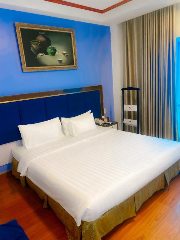 Postel nebo postele na pokoji v ubytování A25 Hotel - 61 Lương Ngọc Quyến