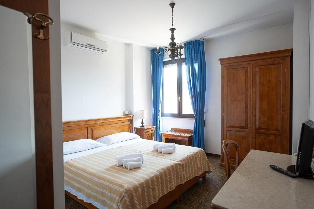 Postel nebo postele na pokoji v ubytování Hotel Napoleon