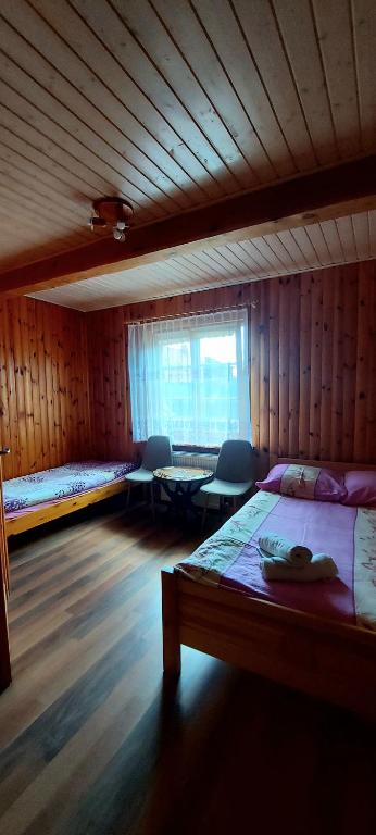 Postel nebo postele na pokoji v ubytování Dom Zajezdny
