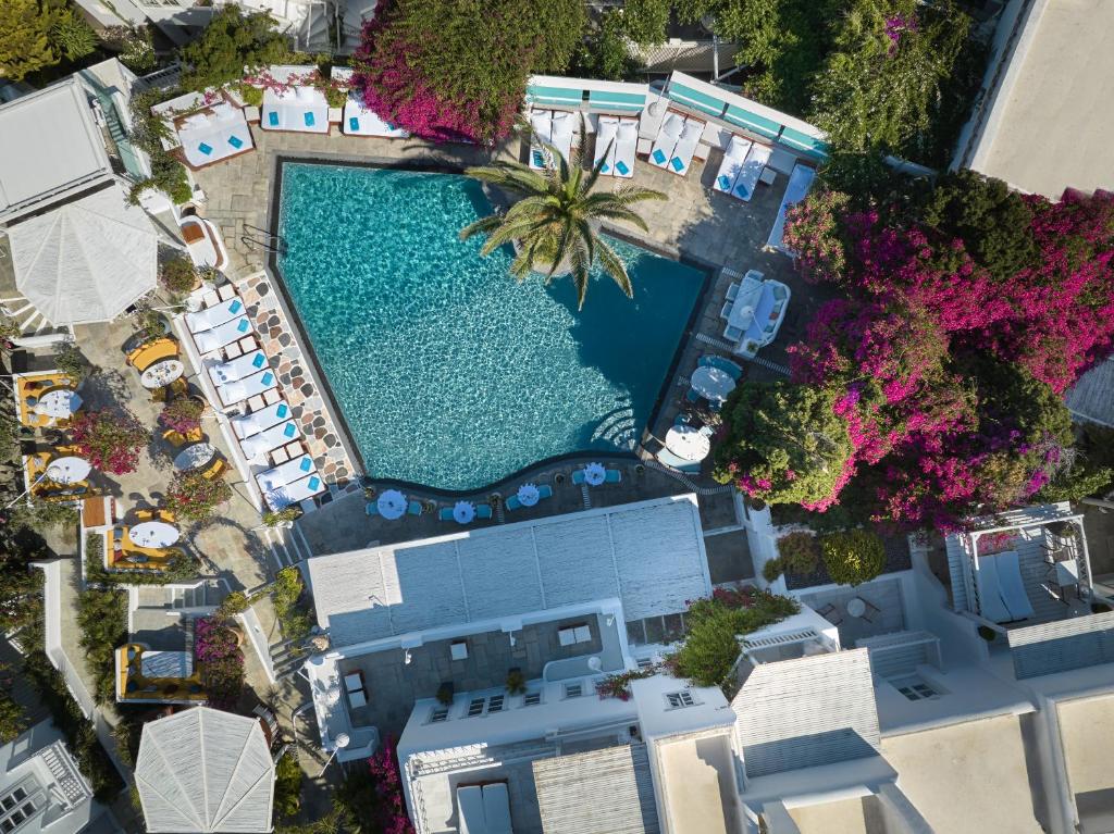 an overhead view of a swimming pool with a resort at Belvedere Mykonos - Main Hotel - The Leading Hotels of the World in Mýkonos City