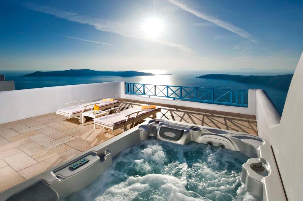 a hot tub on the deck of a yacht at Absolute Bliss in Imerovigli