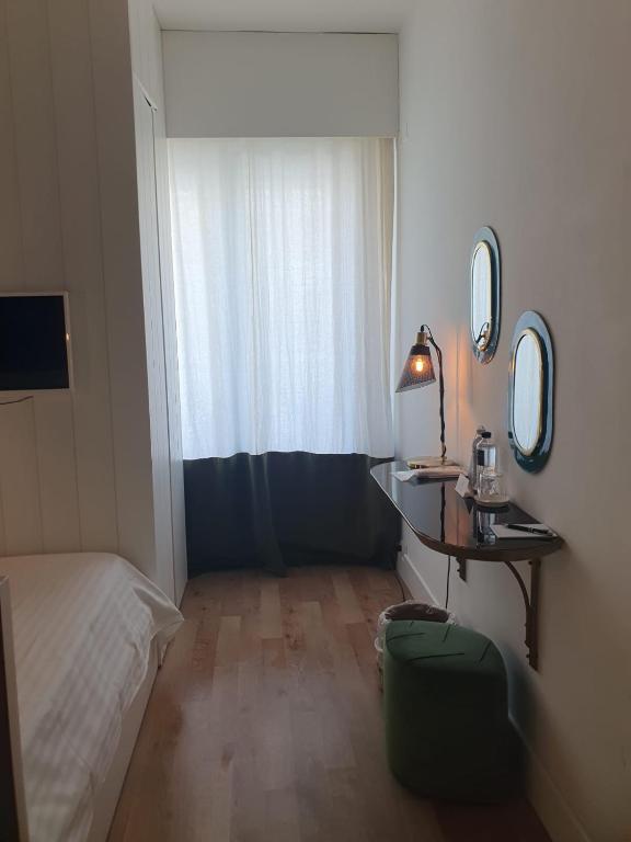 Postel nebo postele na pokoji v ubytování Hotel Ril