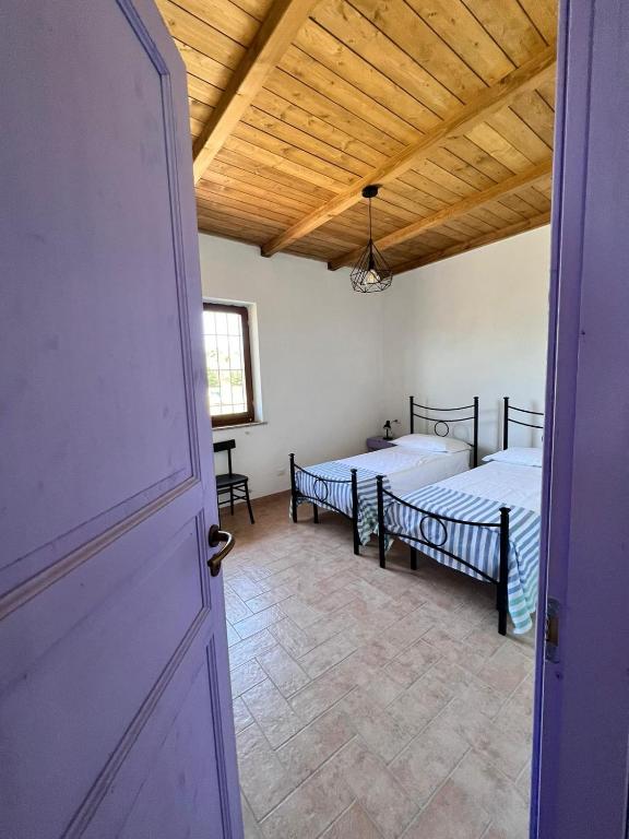 Postel nebo postele na pokoji v ubytování Casa laggiù