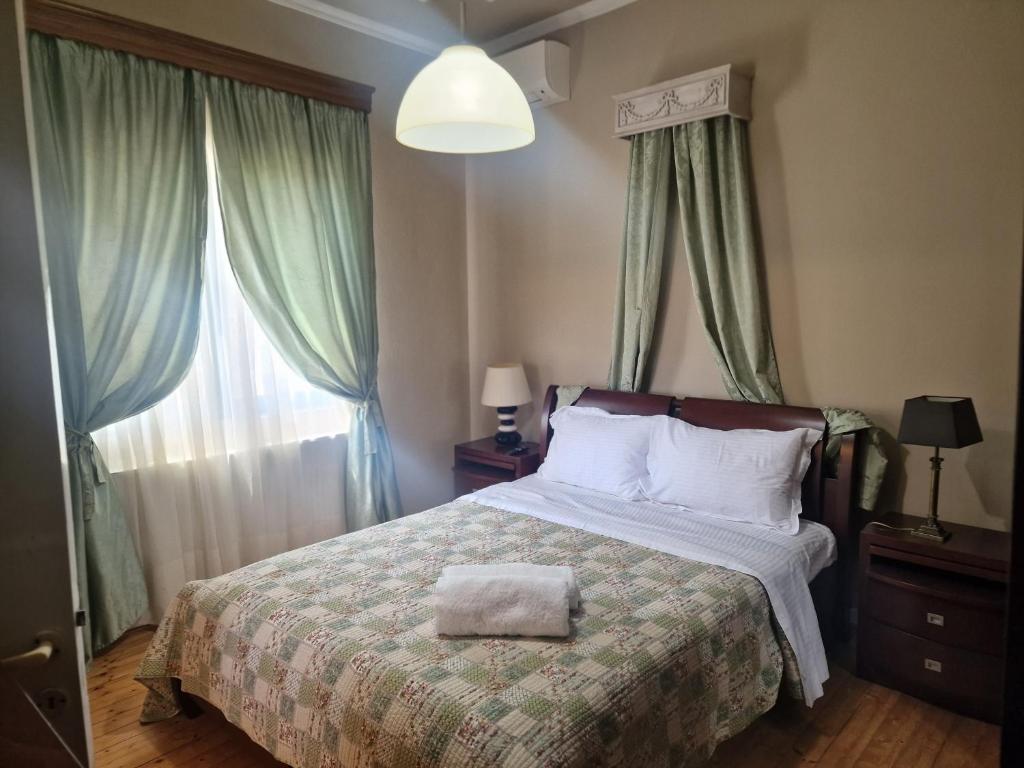 a bedroom with a bed and a large window at Valia's house -Makri Village in Mákri