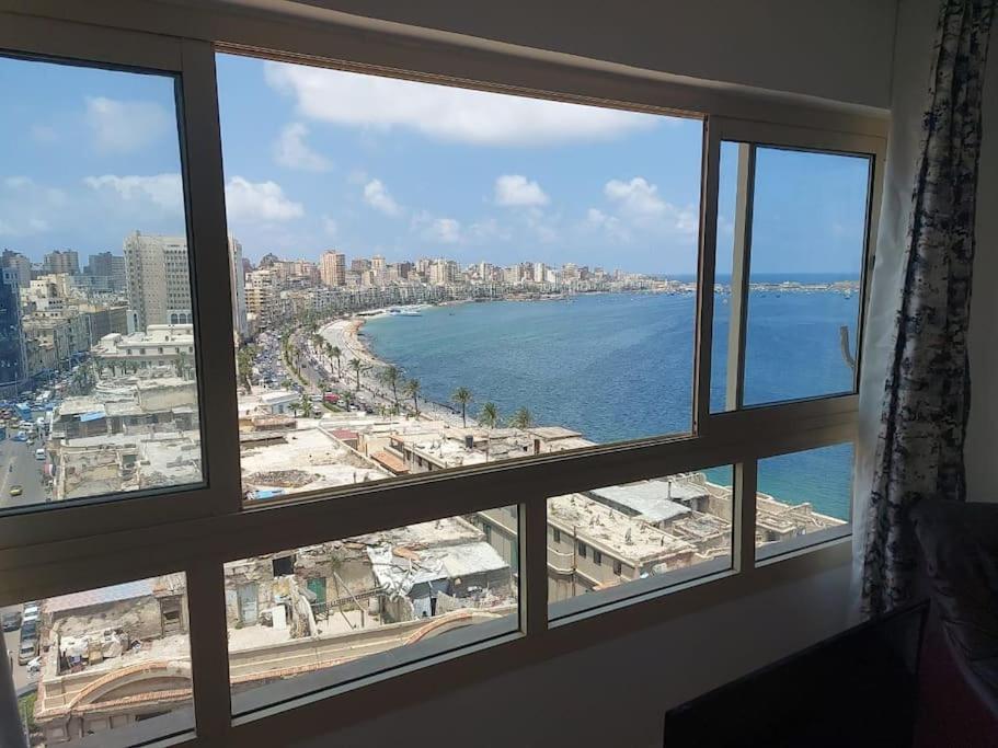 a view of a beach from a window at City center with amazing sea view in Alexandria