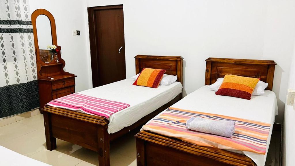 Postel nebo postele na pokoji v ubytování Village feel home stay