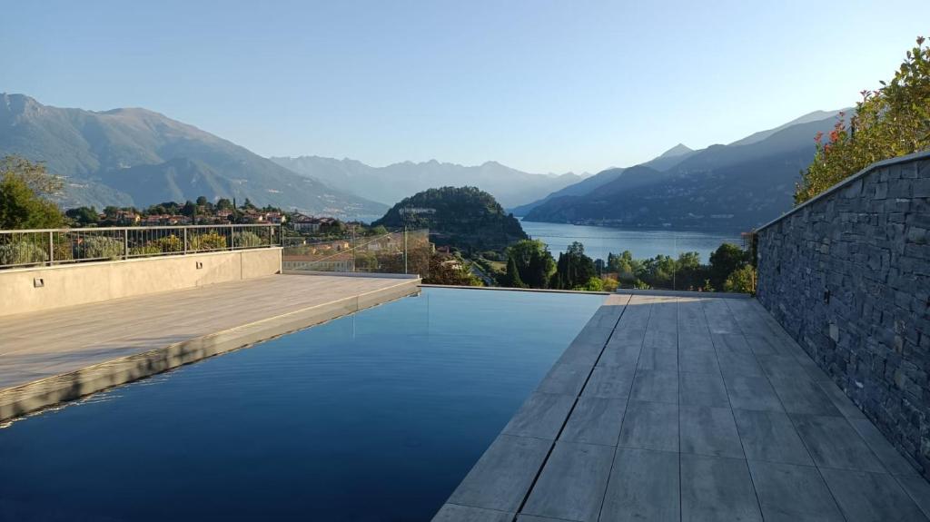 a swimming pool with a view of a lake at Bellagio Dreams,Luxury Apartment in Bellagio