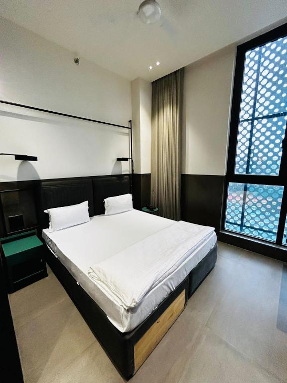 Postel nebo postele na pokoji v ubytování Ibiza Hotel