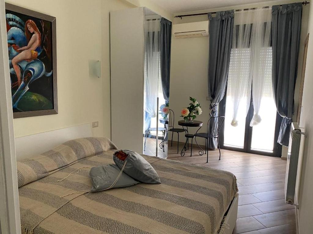 Voodi või voodid majutusasutuse Laviniahouse Nettuno toas