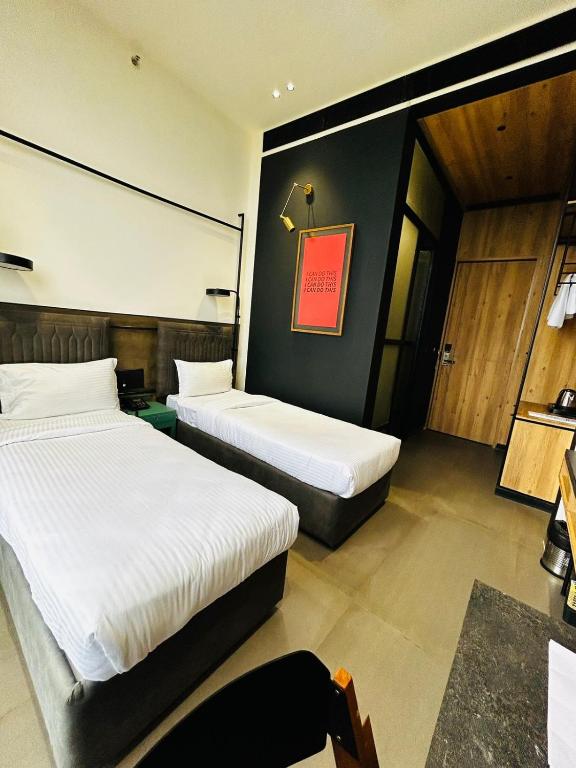 Postel nebo postele na pokoji v ubytování Ibiza Hotel