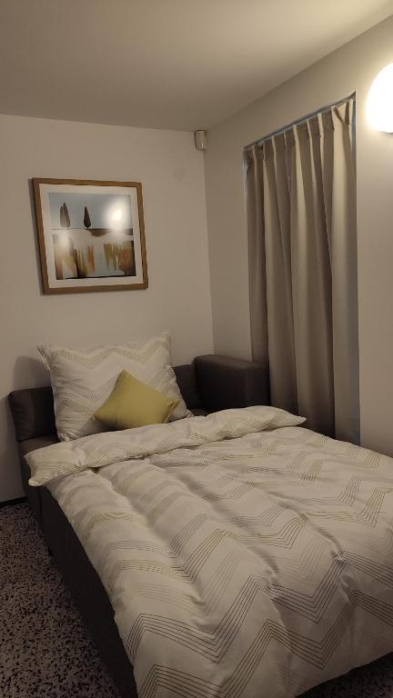 Postel nebo postele na pokoji v ubytování Apartmán Bříza, výhled na zámek