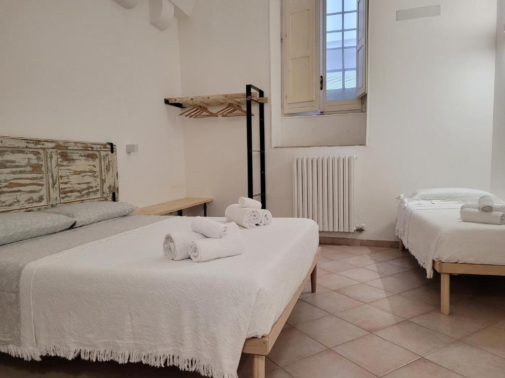Postel nebo postele na pokoji v ubytování Alcentro