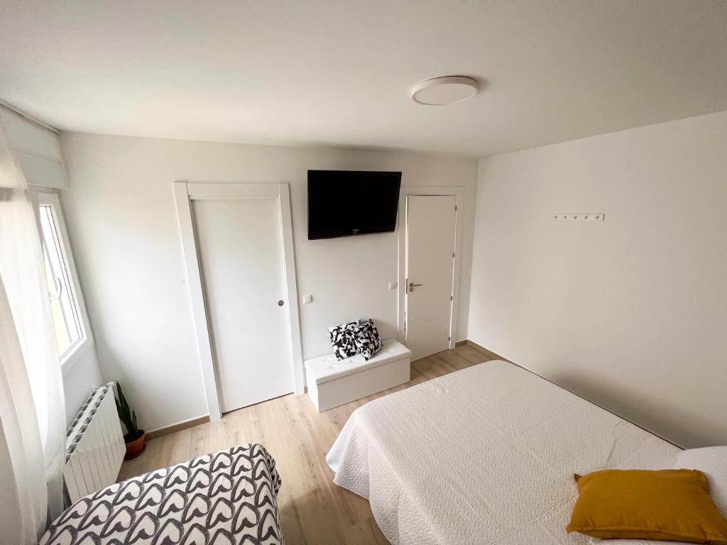 Postel nebo postele na pokoji v ubytování Rooms Laredo