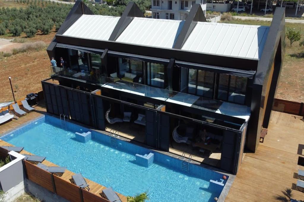 an aerial view of a house with a swimming pool at Boutique hotel with a heat pool in Dosemealti