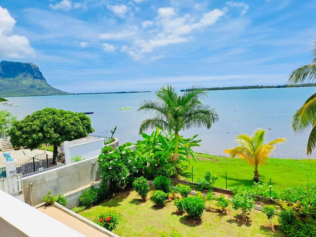 a view of the ocean from the balcony of a house at Lavender in Le Morne