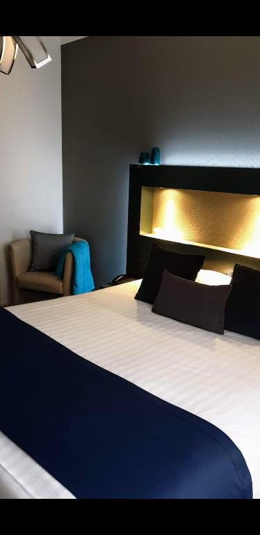 Postel nebo postele na pokoji v ubytování Belrom Hotel