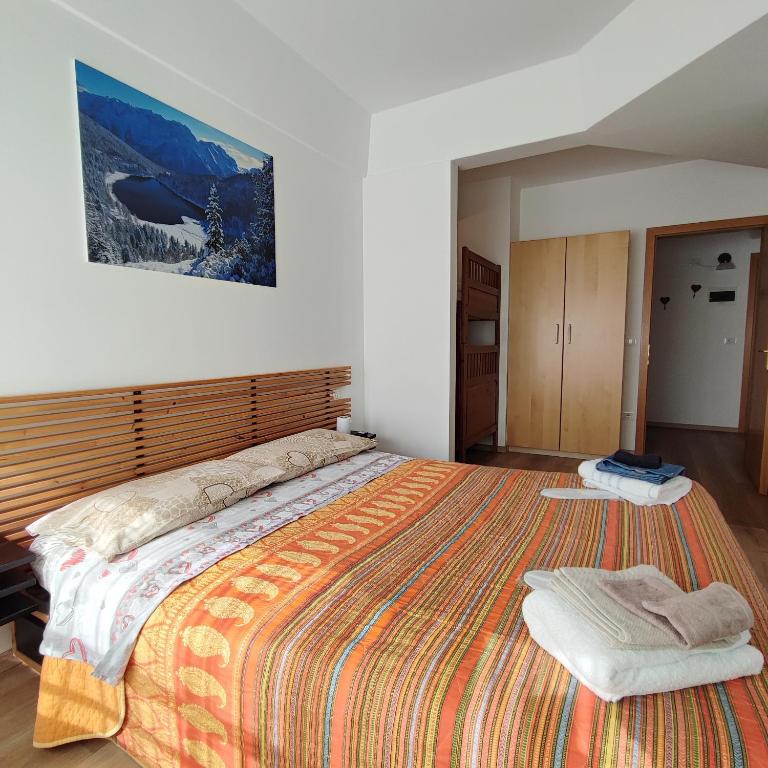 Łóżko lub łóżka w pokoju w obiekcie Genziana Apartment