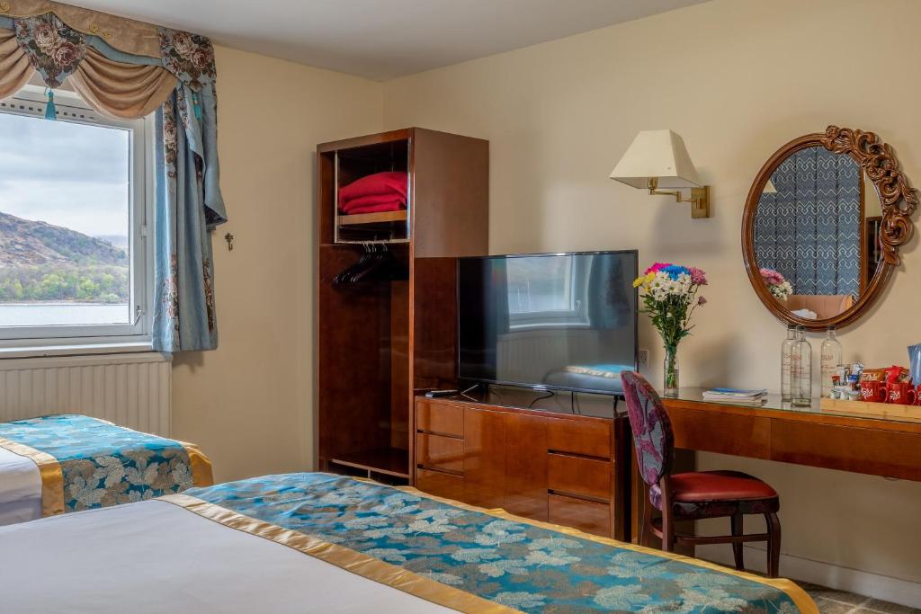 TV a/nebo společenská místnost v ubytování Muthu Fort William Hotel