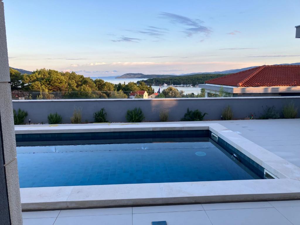 a swimming pool on the roof of a house at Villa Bay View in Stari Grad