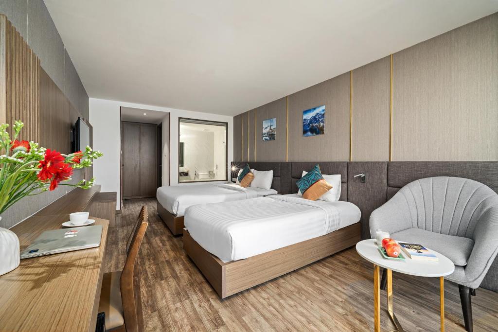 Postel nebo postele na pokoji v ubytování Sochi Hotel