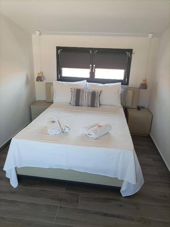 Posteľ alebo postele v izbe v ubytovaní Mulberry Nikiti Resorts
