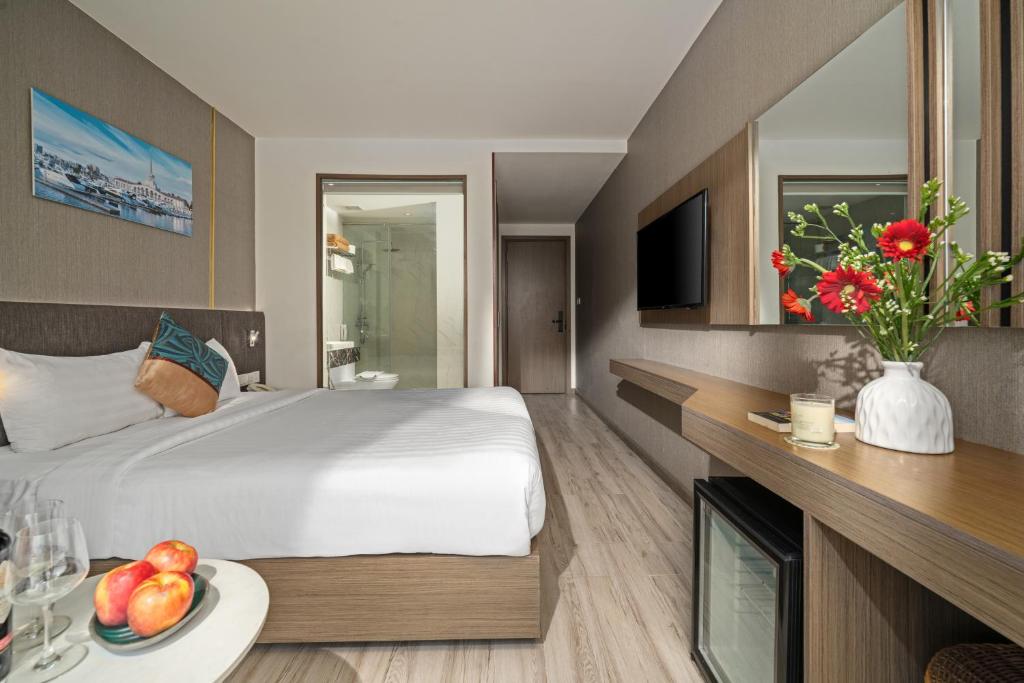 Postel nebo postele na pokoji v ubytování Sochi Hotel