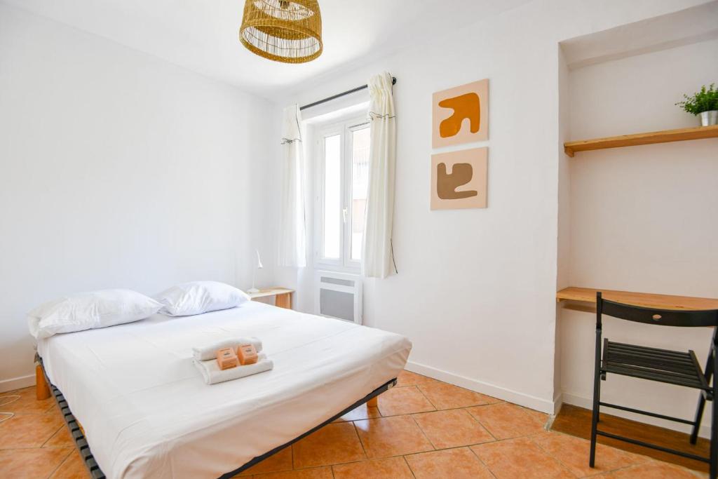 Una cama o camas en una habitaci&oacute;n de Maison de charme 2 ch &agrave; Vauban proche Vieux Port