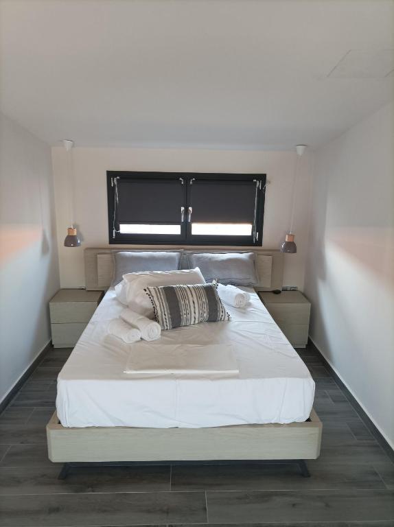 Posteľ alebo postele v izbe v ubytovaní Mulberry Nikiti Resorts