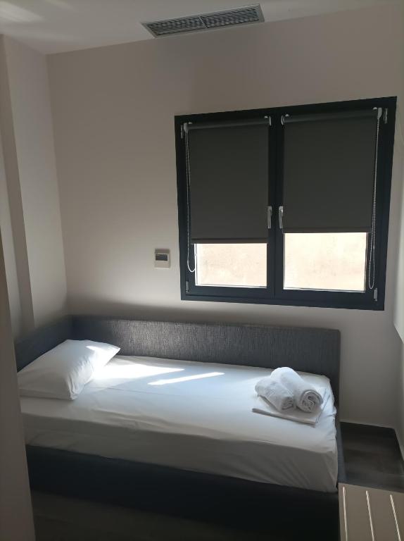 Posteľ alebo postele v izbe v ubytovaní Mulberry Nikiti Resorts