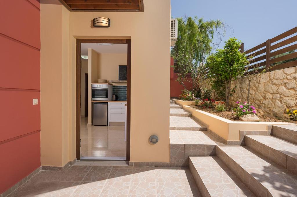 a hallway leading to a kitchen in a house at Anna Boutique Apartment in Kato Daratso