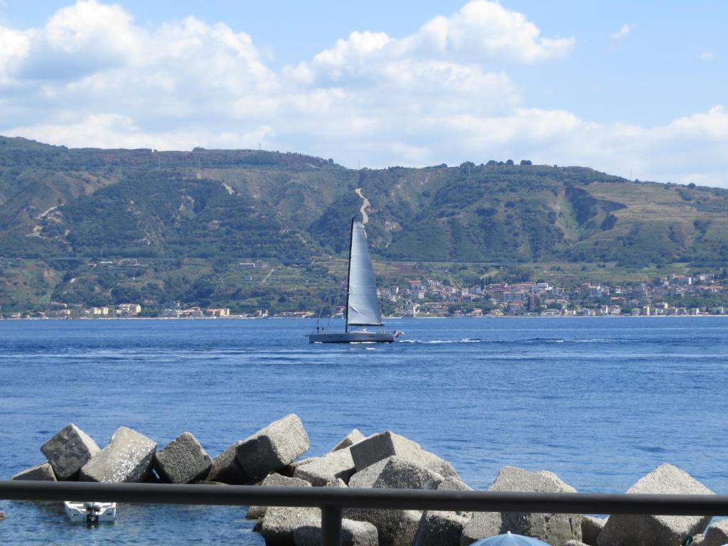 a sailboat in a large body of water at Marea in Messina
