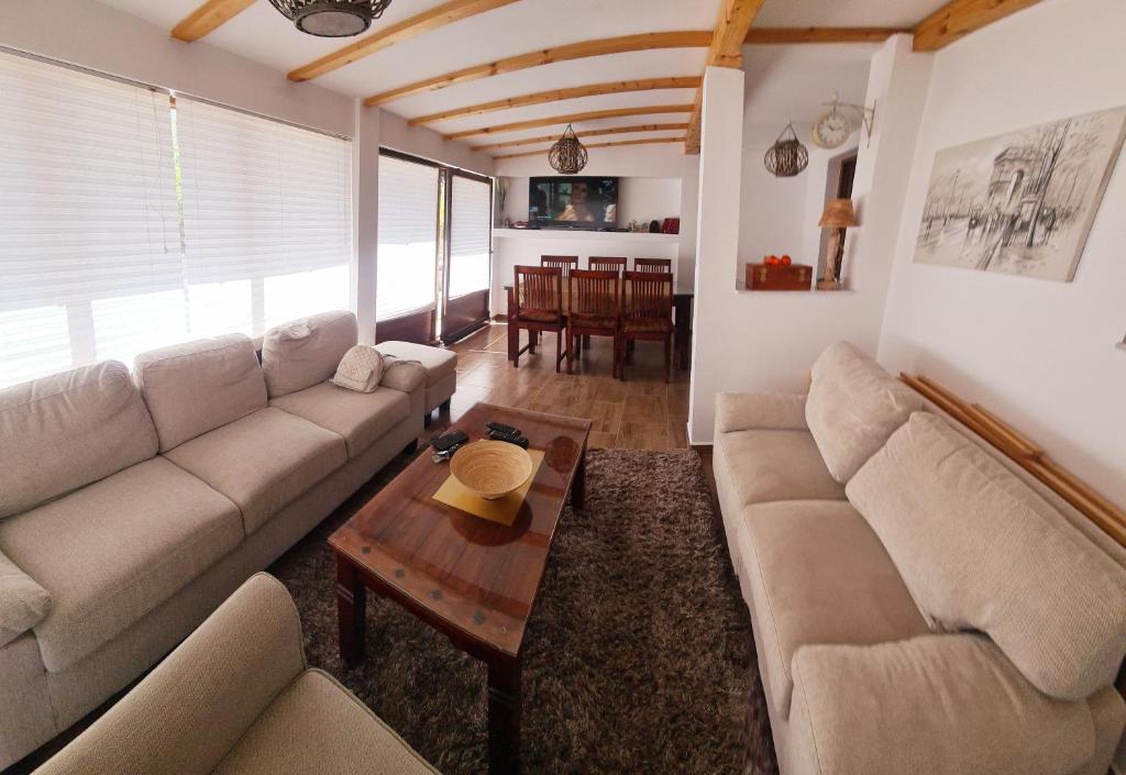 a living room with a couch and a table at Apartman Lejla Vlašić in Vlasic