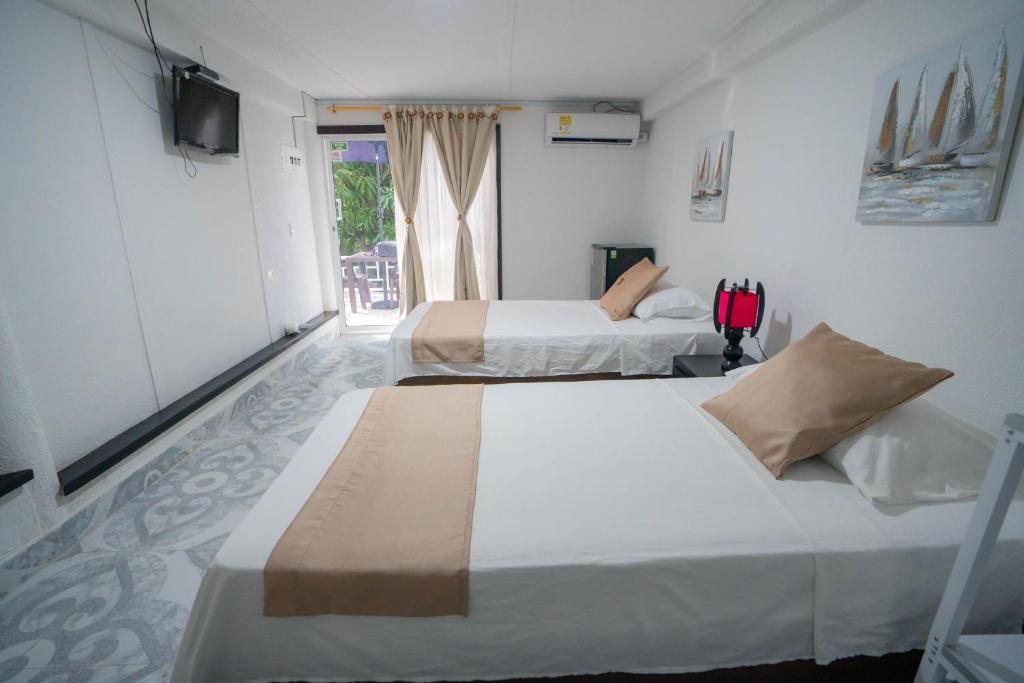 Postel nebo postele na pokoji v ubytování Posada Jasmina Place