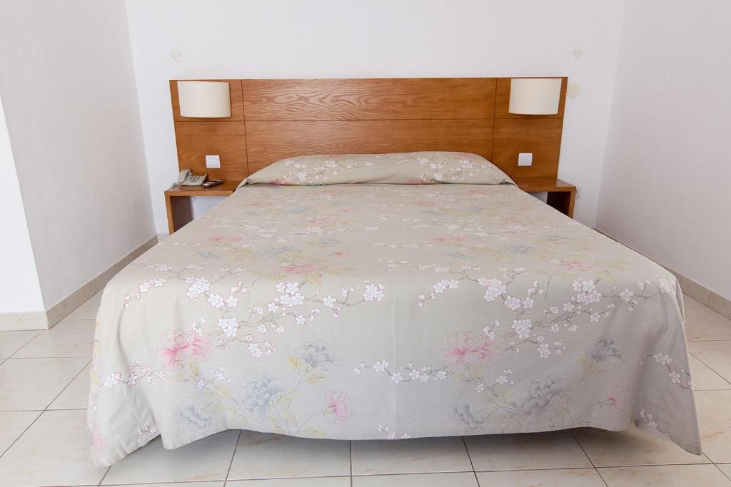 Postel nebo postele na pokoji v ubytování Hotel Solmar