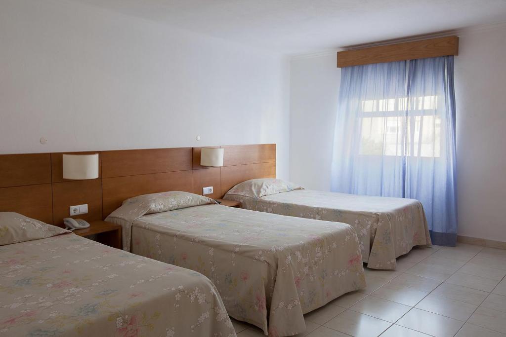 Postel nebo postele na pokoji v ubytování Hotel Solmar