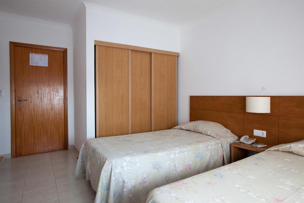 Postel nebo postele na pokoji v ubytování Hotel Solmar
