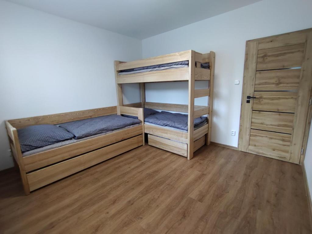 Postel nebo postele na pokoji v ubytování Apartmán Karlovice - Jeseníky