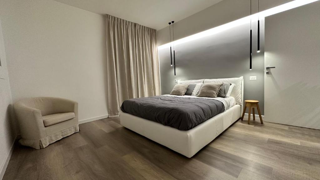 Posteľ alebo postele v izbe v ubytovaní Appartamento Deluxe alle Porte del Centro Storico