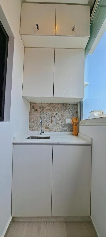 Kuchyň nebo kuchyňský kout v ubytování RABAT Residence - OCEAN STAY