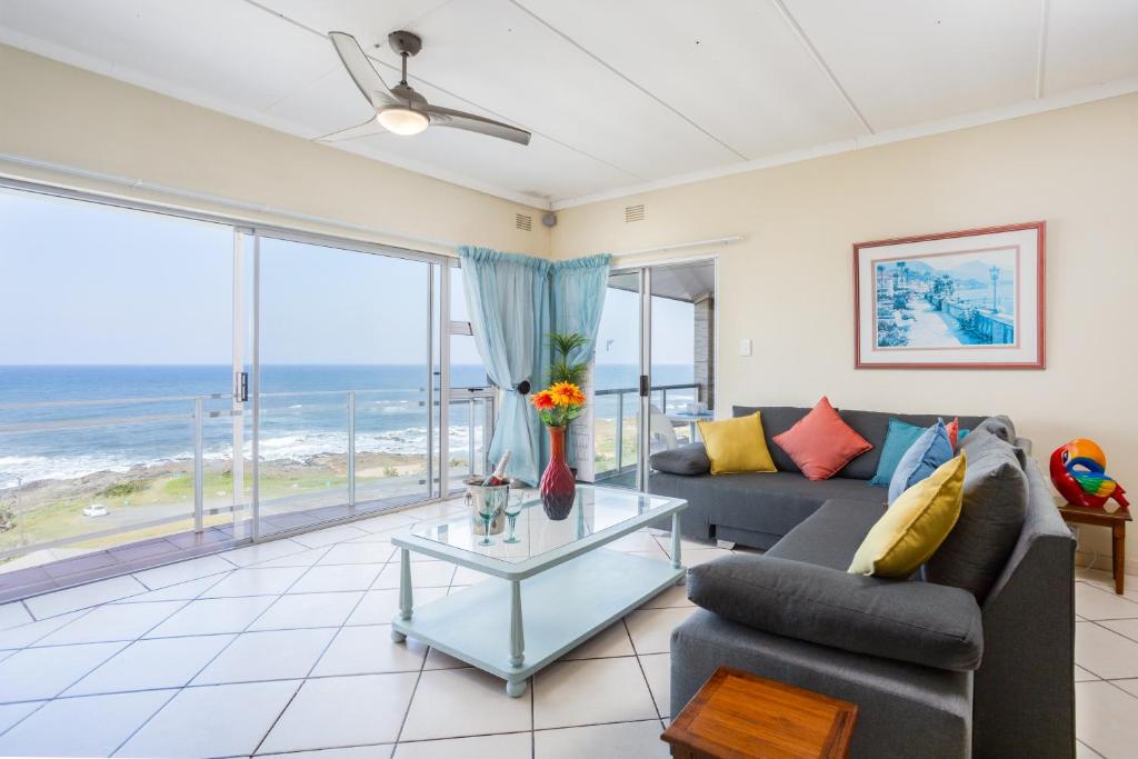 a living room with a view of the ocean at Sue Casa 12 in Margate